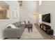 Bright living room features soaring ceilings, large windows, and modern furniture at 507 Oakleaf Ct, Acworth, GA 30102