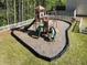 A lovely community playground offers a slide and other equipment in a fenced location at 507 Oakleaf Ct, Acworth, GA 30102