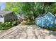 Large backyard featuring a patio with a seating area and a shed at 777 Antone Nw St, Atlanta, GA 30318