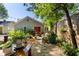 Beautiful backyard with a sitting area, patio, string lights, green foliage and gravel at 777 Antone Nw St, Atlanta, GA 30318