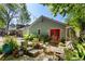 A beautiful backyard with a patio, seating area, table, chairs, string lights and green foliage at 777 Antone Nw St, Atlanta, GA 30318