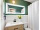 Charming bathroom with updated vanity, new fixtures and lighted mirror at 777 Antone Nw St, Atlanta, GA 30318