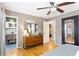 Bedroom offers hardwood floors, ceiling fan, and full view to updated bathroom at 777 Antone Nw St, Atlanta, GA 30318