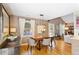 Open dining room with wood floors, modern lighting and decor at 777 Antone Nw St, Atlanta, GA 30318
