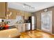 Well-lit kitchen with stainless steel appliances, light-colored cabinets, and a door leading to the outside at 777 Antone Nw St, Atlanta, GA 30318
