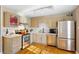 Updated kitchen featuring stainless steel appliances, light-colored cabinets, and hardwood floors at 777 Antone Nw St, Atlanta, GA 30318