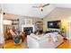 Cozy living room with a fireplace, comfortable seating, hardwood floors, and ample natural light at 777 Antone Nw St, Atlanta, GA 30318