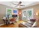 Office featuring hardwood floors, a ceiling fan, computer desk, leather sofa and french doors at 777 Antone Nw St, Atlanta, GA 30318