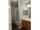 Bathroom features a shower-tub combination and oak vanity with great counter space at 220 Rehobeth Way, Fayetteville, GA 30214
