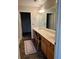 Bathroom with a long vanity, double sinks, neutral walls and tile-look floors at 220 Rehobeth Way, Fayetteville, GA 30214