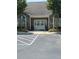 Elegant entrance with stone accents, double doors, and meticulously landscaped flower beds on either side at 220 Rehobeth Way, Fayetteville, GA 30214