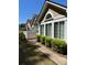 Inviting exterior view showcasing manicured shrubbery, coordinated architectural elements, and a walkway at 220 Rehobeth Way, Fayetteville, GA 30214