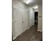 Hallway with storage closet and laundry machines visible in the background at 220 Rehobeth Way, Fayetteville, GA 30214