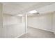 Finished basement area with neutral carpet, paneled walls, and a partial wall at 278 Benjamin Dr, Rockmart, GA 30153
