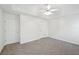 Bedroom featuring two doors, tray ceiling, ceiling fan, carpet flooring and lots of natural light at 278 Benjamin Dr, Rockmart, GA 30153