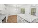 Eat-in kitchen features granite countertops, an island with seating, and a door leading to the backyard at 278 Benjamin Dr, Rockmart, GA 30153