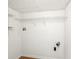 Laundry room with white walls and simple shelving at 278 Benjamin Dr, Rockmart, GA 30153