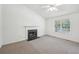 Spacious living room with a fireplace, ceiling fan, and bright lighting at 278 Benjamin Dr, Rockmart, GA 30153