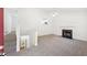 Bright living room featuring a fireplace, ceiling fan, and view of kitchen at 278 Benjamin Dr, Rockmart, GA 30153