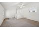 Bright living room featuring neutral carpet, stairs to upper level, and windows offering an abundance of light at 278 Benjamin Dr, Rockmart, GA 30153