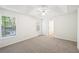 Bright main bedroom with large windows allowing natural light and carpet flooring at 278 Benjamin Dr, Rockmart, GA 30153