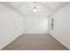 Spacious main bedroom boasts tray ceiling, ceiling fan, and large window at 278 Benjamin Dr, Rockmart, GA 30153