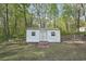 Detached shed in a fenced backyard, perfect for extra storage or a workshop at 278 Benjamin Dr, Rockmart, GA 30153