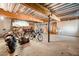 Basement with unfinished ceiling, workshop, and storage for bikes and lawn equipment at 3531 Vintage Trl, Woodstock, GA 30189