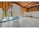 Unfinished basement featuring a ping pong table, basketball hoop, and natural light at 3531 Vintage Trl, Woodstock, GA 30189