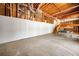 Unfinished basement space with exposed wood beams and a ping pong table at 3531 Vintage Trl, Woodstock, GA 30189