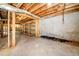 Unfinished basement with exposed ceiling and wood framing, ready for customization at 3531 Vintage Trl, Woodstock, GA 30189