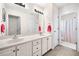 Bathroom with a double sink vanity and a separate shower area with a striped curtain at 3531 Vintage Trl, Woodstock, GA 30189