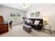 Bedroom with a futon, desk, and a window providing natural light at 3531 Vintage Trl, Woodstock, GA 30189