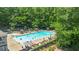 Aerial view of the community pool with lounge chairs and umbrellas at 3531 Vintage Trl, Woodstock, GA 30189