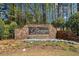The Fairways at Towne Lake entrance sign with stone surround and landscaping at 3531 Vintage Trl, Woodstock, GA 30189