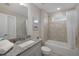 Bright bathroom with granite vanity, tiled shower and tub showcasing a functional and clean design at 3825 Raeburn Rd, Cumming, GA 30028