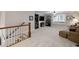 A bright and spacious carpeted bonus room with neutral walls, a ceiling fan, and abundant natural light from multiple windows at 3825 Raeburn Rd, Cumming, GA 30028