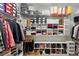 Organized walk-in closet with shelving and hanging racks for ample storage at 3825 Raeburn Rd, Cumming, GA 30028