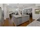 Kitchen island with a view of the living and dining areas in an open concept design at 3825 Raeburn Rd, Cumming, GA 30028