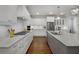 Gourmet kitchen boasts granite countertops, a large island, and stainless steel appliances at 3825 Raeburn Rd, Cumming, GA 30028