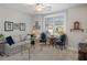 Cozy living room features a comfortable sofa, stylish chairs, and natural light at 3825 Raeburn Rd, Cumming, GA 30028