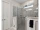 Glass-enclosed shower with tiled surround and rain shower head at 3825 Raeburn Rd, Cumming, GA 30028