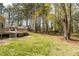 Lush backyard with mature trees and great lawn space at 4220 Smith Rd, Loganville, GA 30052