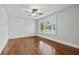 Bright bedroom with hardwood floors, ceiling fan and large bay window at 4220 Smith Rd, Loganville, GA 30052
