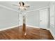 Bedroom featuring hardwood floors, neutral colored walls, and a modern ceiling fan at 4220 Smith Rd, Loganville, GA 30052