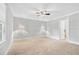 Spacious, neutral bedroom with carpet, recessed lights and base-molding at 4220 Smith Rd, Loganville, GA 30052