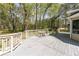 Charming gray deck with a great backyard and lush greenery in a serene setting at 4220 Smith Rd, Loganville, GA 30052