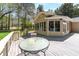 A great home featuring an inviting deck with glass table and a sunroom at 4220 Smith Rd, Loganville, GA 30052