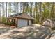 Single-car attached garage on a brick home with a paved driveway at 4220 Smith Rd, Loganville, GA 30052