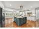 Modern kitchen with granite countertops, island cooktop, and stainless steel appliances at 4220 Smith Rd, Loganville, GA 30052